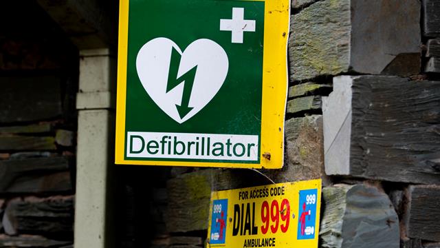 Defibrillator sign on wall