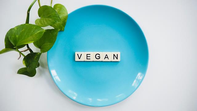 blue plate with vegan words