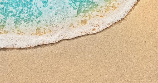 Top view of beach water meeting sand